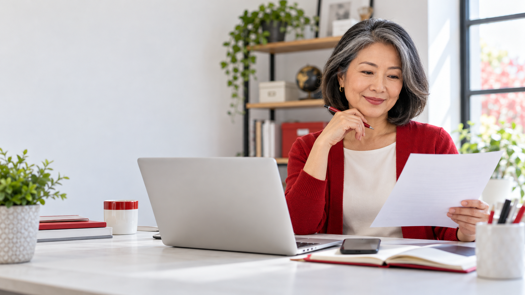 Experienced small business owner reviewing domain and website security settings on a laptop